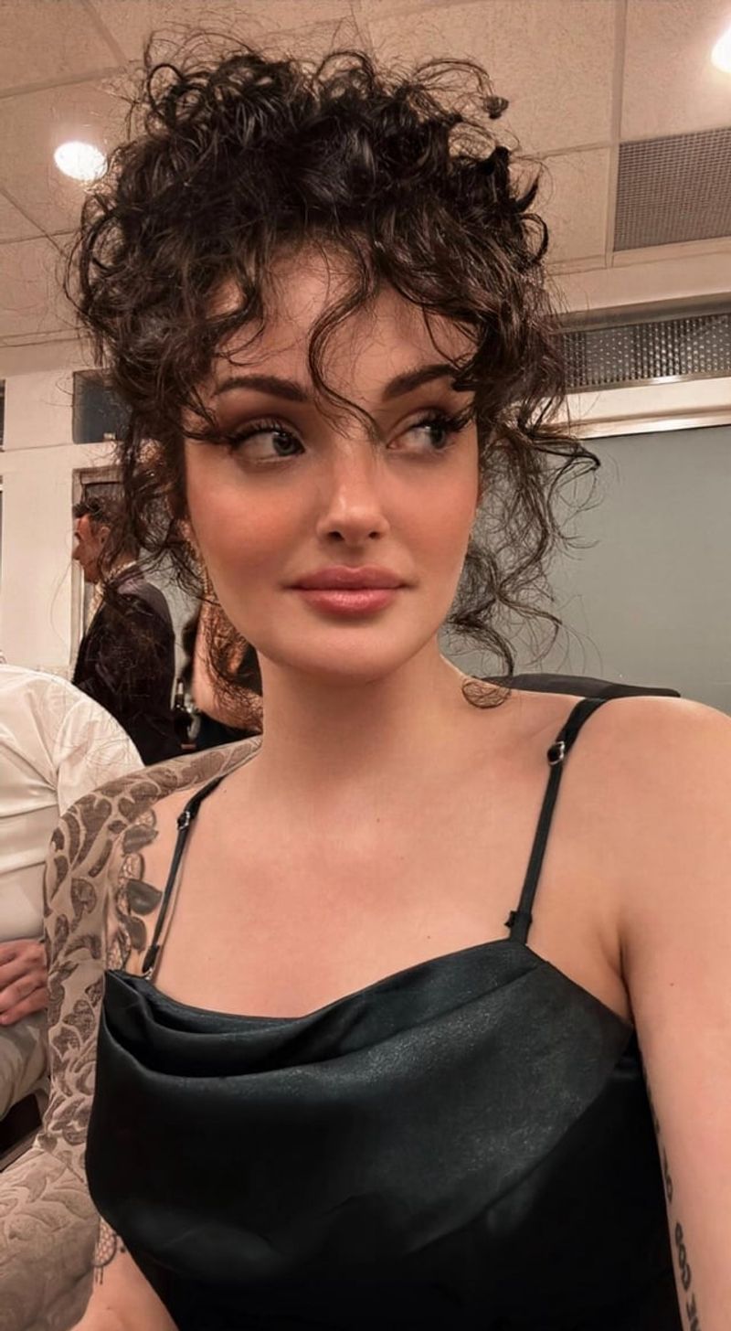 Curly Bun with Bangs